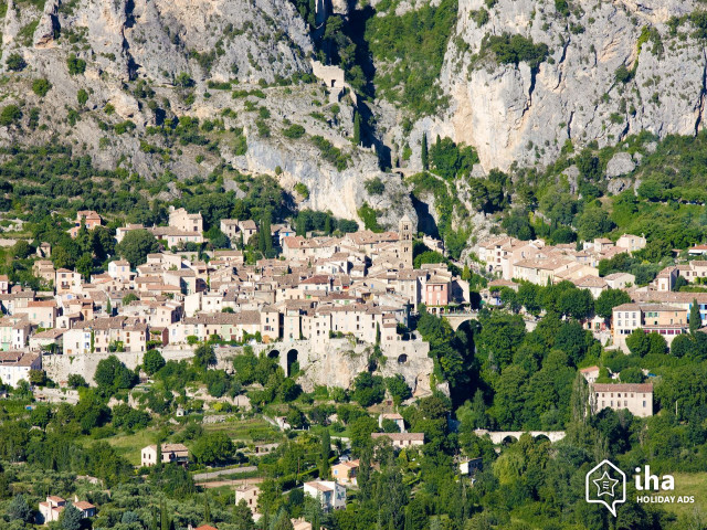 Village nestled mountains trees background free wallpaper - medium preview image