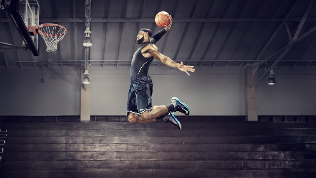 Man jumping basketball air hand free wallpaper - medium preview image