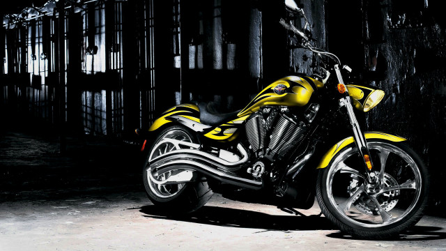 Yellow motorcycle dark room cage free wallpaper - medium preview image