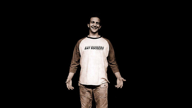 Man skateboard dark smiling camera free wallpaper - medium preview image
