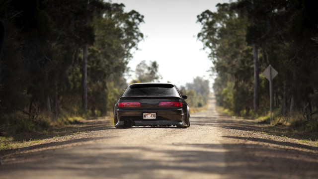 Car parked dirt road forest free wallpaper - medium preview image