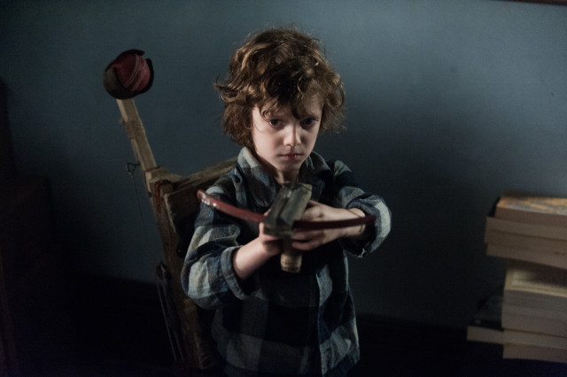 Young boy holding knife wooden free wallpaper - medium preview image