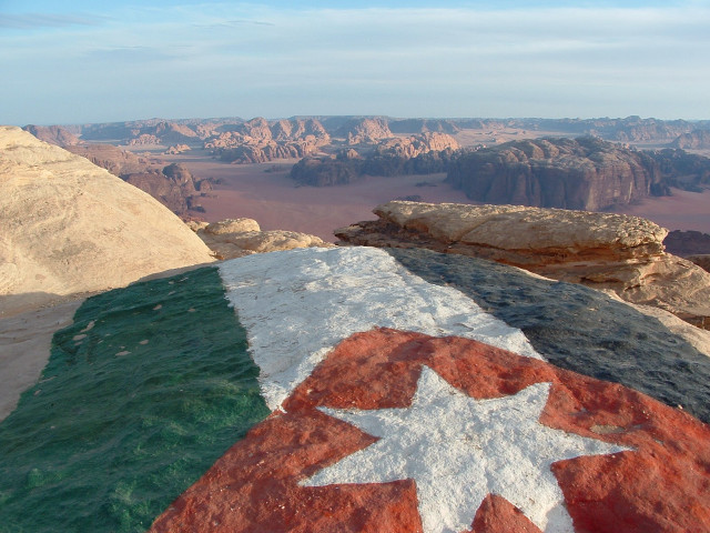 Flag painted rock desert mountains free wallpaper - medium preview image