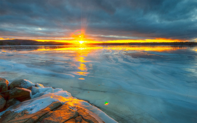 Sunset frozen lake rocks ice free wallpaper - medium preview image