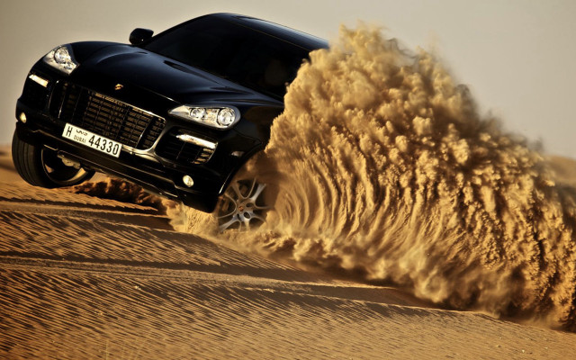 Black car desert sand explosion free wallpaper - medium preview image