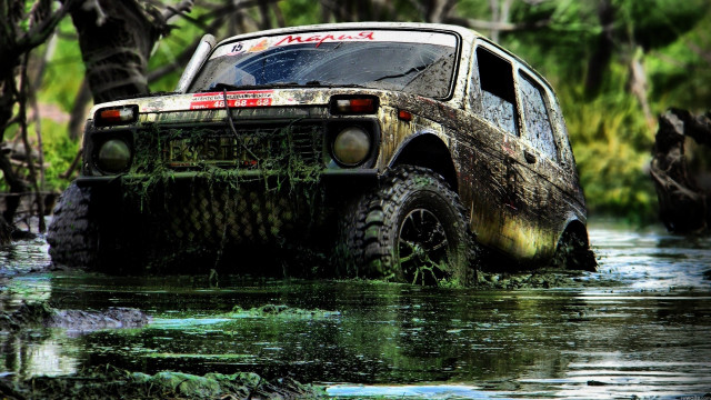 Truck driving muddy river trees free wallpaper - medium preview image