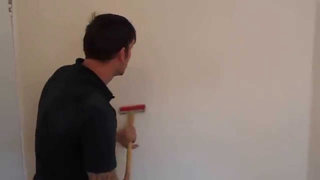 Man holding paint roller wall free wallpaper - medium preview image
