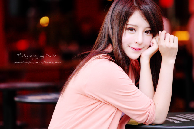Woman sitting table hand face free wallpaper - medium preview image