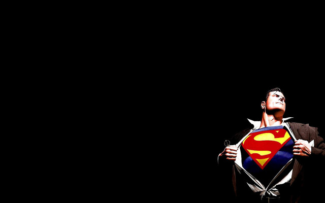 Man holding superman symbol looking #2 free wallpaper - medium preview image