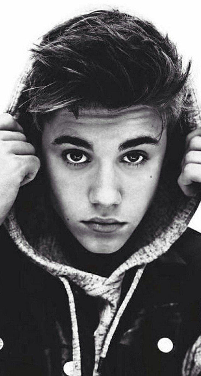 Young man hoodie serious face free wallpaper - medium preview image