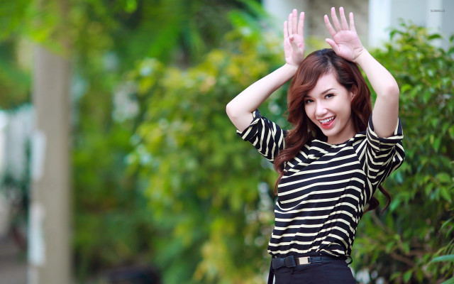 Woman striped shirt waving hands free wallpaper - medium preview image