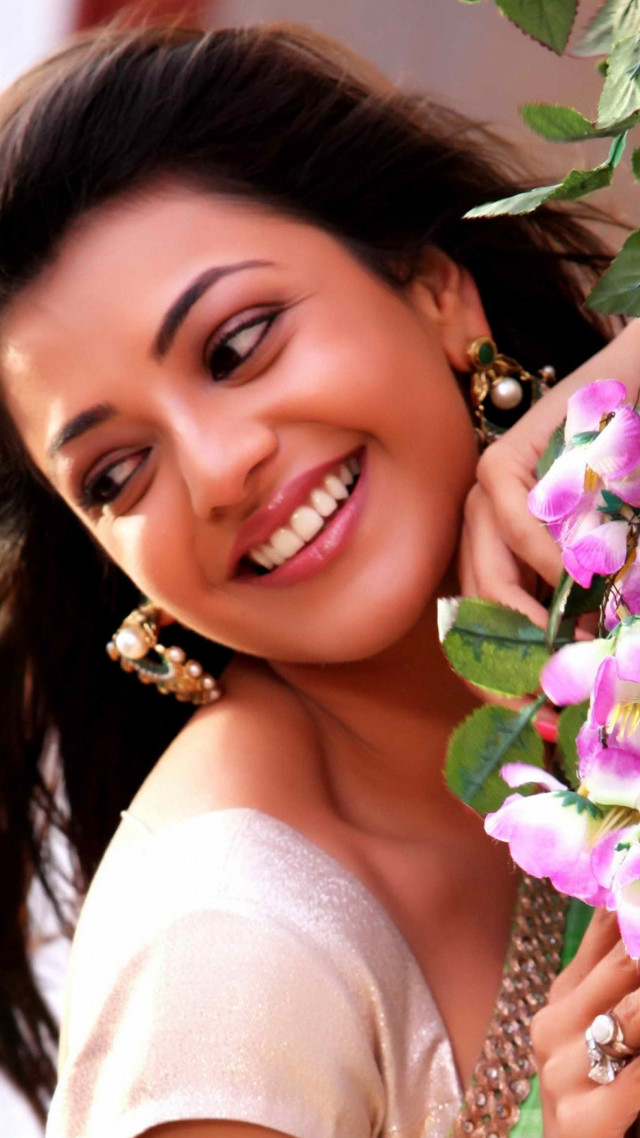 Woman holding flowers smiling camera #3 free wallpaper - medium preview image