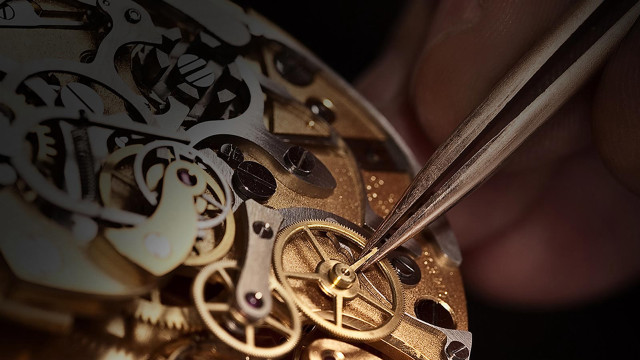 Person holding scissors clock gears free wallpaper - medium preview image