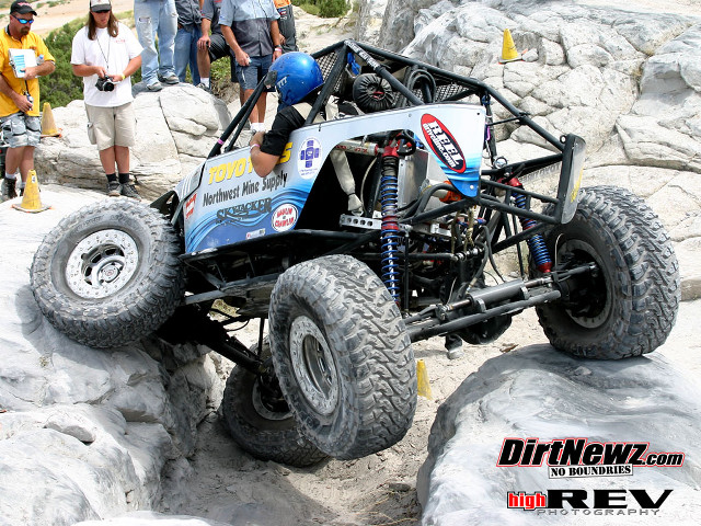 Man riding buggy rock formation free wallpaper - medium preview image