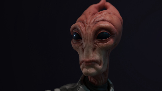 Red alien mask closeup black free wallpaper - medium preview image