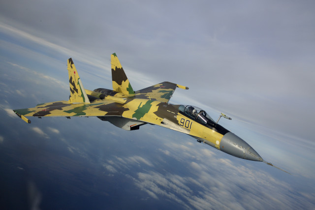 Camouflaged fighter jet flying sky #2 free wallpaper - medium preview image