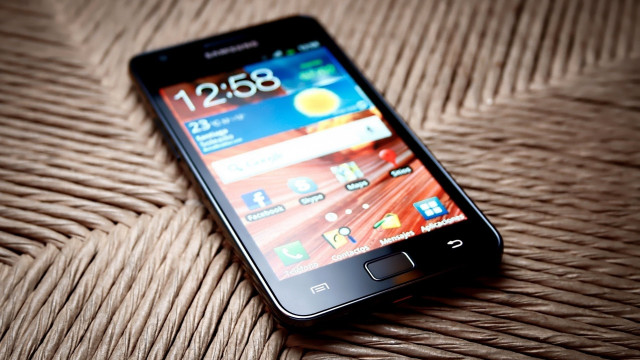 Cellphone table brown wicker photorealism free wallpaper - medium preview image