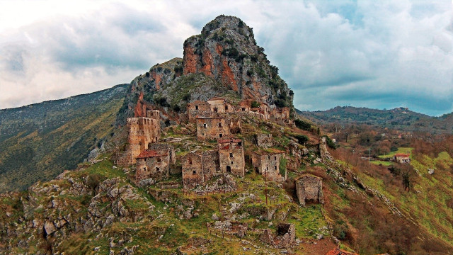 Mountain tall rock formation buildings free wallpaper - medium preview image