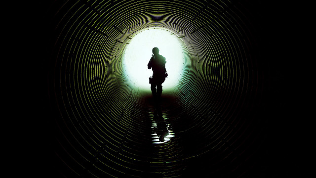 Person standing dark tunnel bike free wallpaper - medium preview image