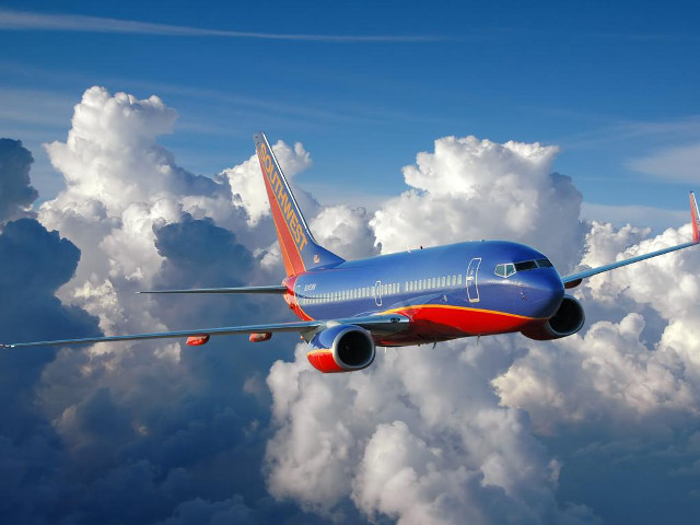 Blue red airplane flying clouds free wallpaper - medium preview image