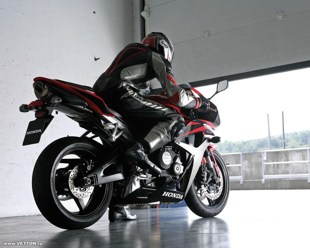 Man leather outfit motorcycle garage free wallpaper - medium preview image