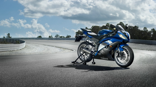 Blue motorcycle parked road hill free wallpaper - medium preview image