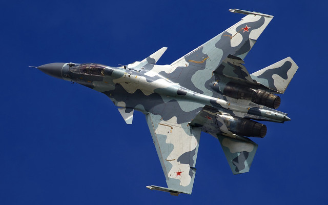 Camouflaged fighter jet blue sky #3 free wallpaper - medium preview image