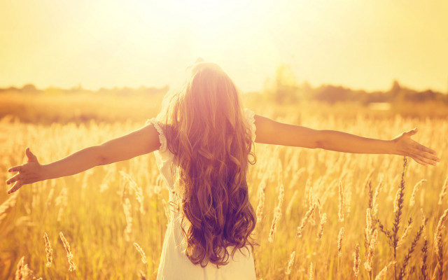 Woman standing field arms outstretched free wallpaper - medium preview image