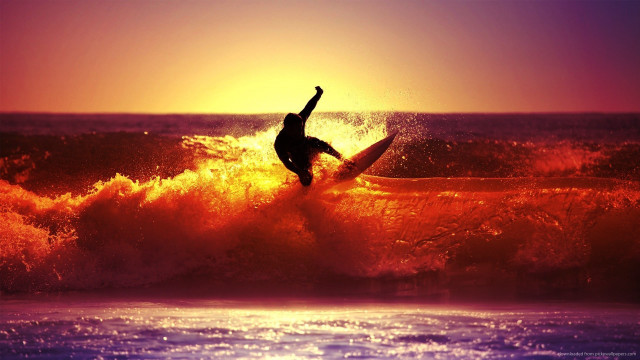 Surfer riding wave ocean sunset #6 free wallpaper - medium preview image