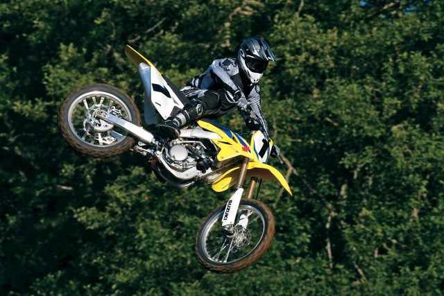 Motorcycle air forest trees bushes free wallpaper - medium preview image