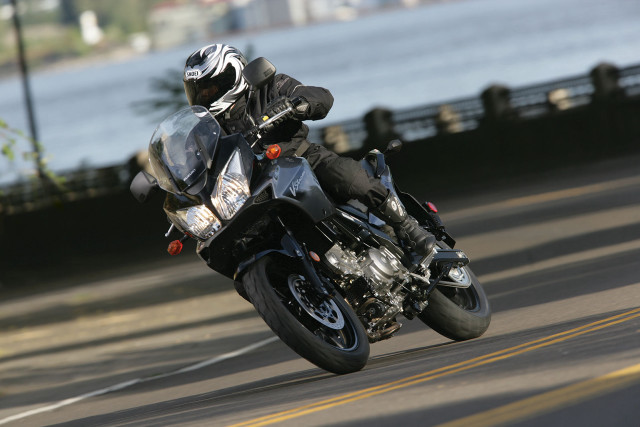 Man motorcycle helmet bridge lake free wallpaper - medium preview image