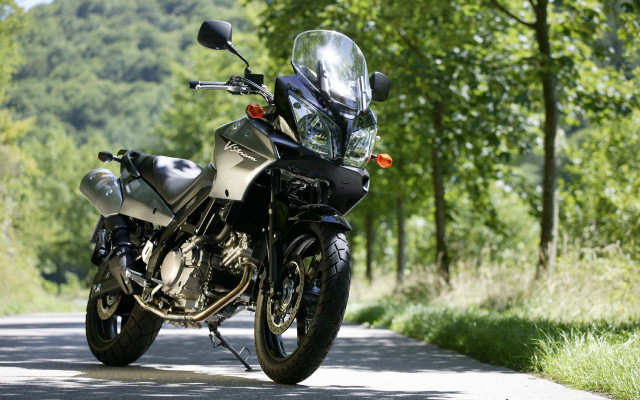 Motorcycle parked road trees grass #2 free wallpaper - medium preview image