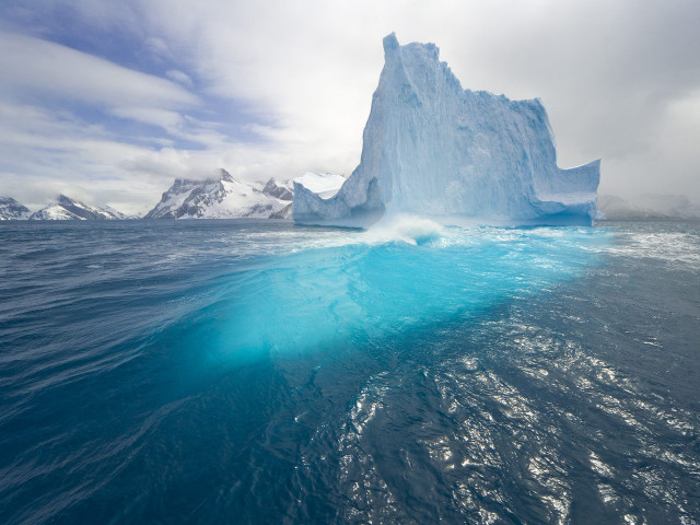Iceberg floating ocean mountain range free wallpaper - medium preview image