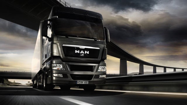 Truck driving highway bridge dark free wallpaper - medium preview image