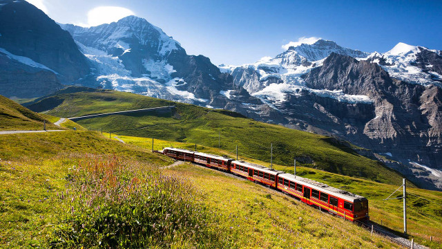 Train lush valley snowy mountains free wallpaper - medium preview image