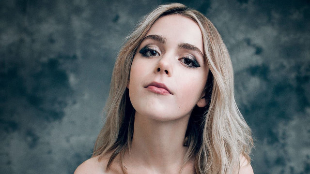 Woman necklace looking up serious free wallpaper - medium preview image