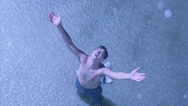 Man standing water arms outstretched free wallpaper - medium preview image