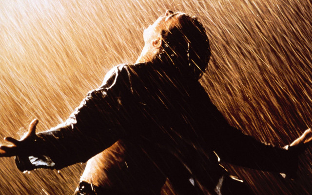 Man standing rain arms outstretched free wallpaper - medium preview image