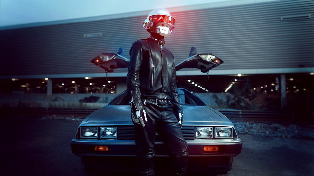 Man leather outfit sitting car free wallpaper - medium preview image