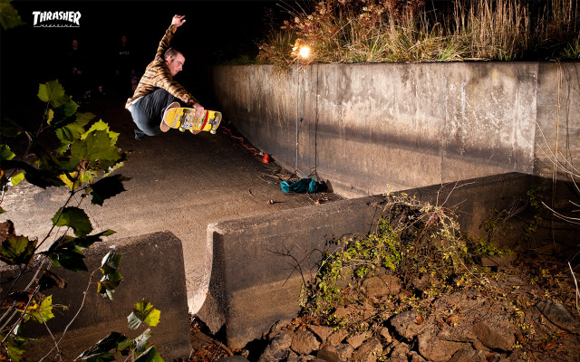 Man skateboarding cement ramp night free wallpaper - medium preview image