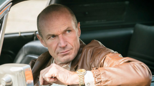 Man leather jacket sitting car free wallpaper - medium preview image