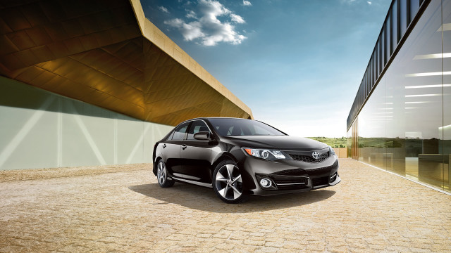 Black car parked building brick free wallpaper - medium preview image