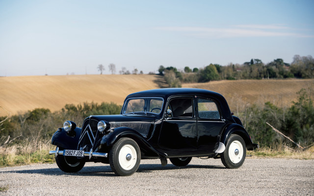Old black car gravel road free wallpaper - medium preview image