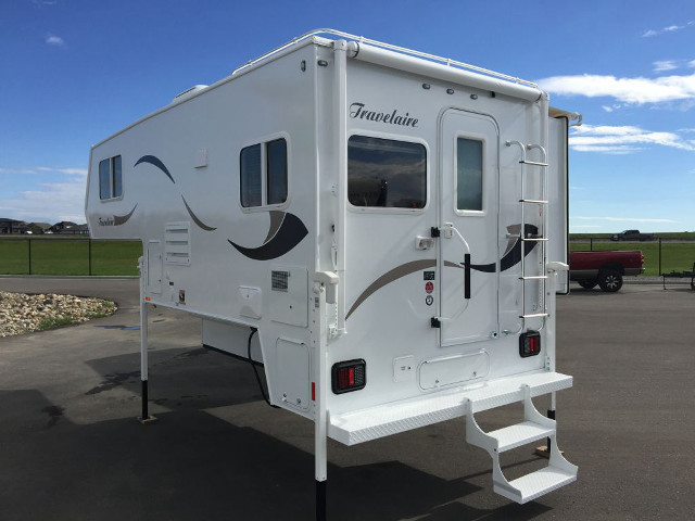 White trailer parking lot grass free wallpaper - medium preview image