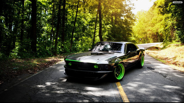 Car parked woods green rims free wallpaper - medium preview image