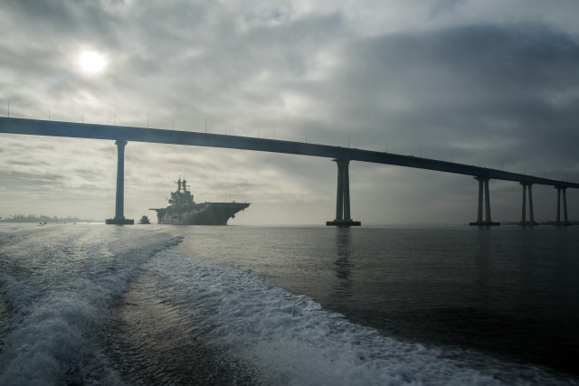 Large ship sailing under bridge free wallpaper - medium preview image