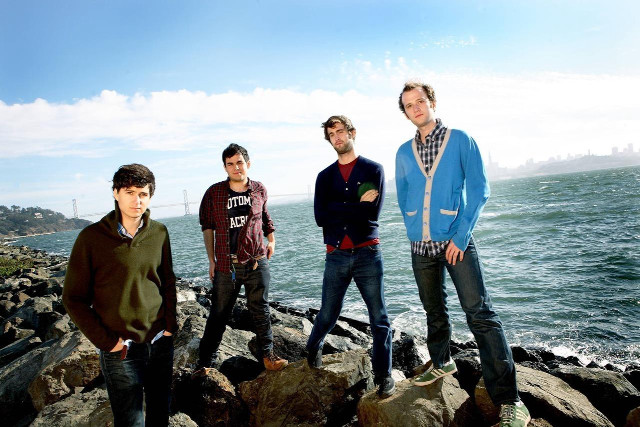 Young men rocky beach ocean free wallpaper - medium preview image