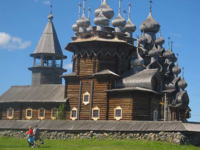 Wooden castle spires grassy field free wallpaper - medium preview image