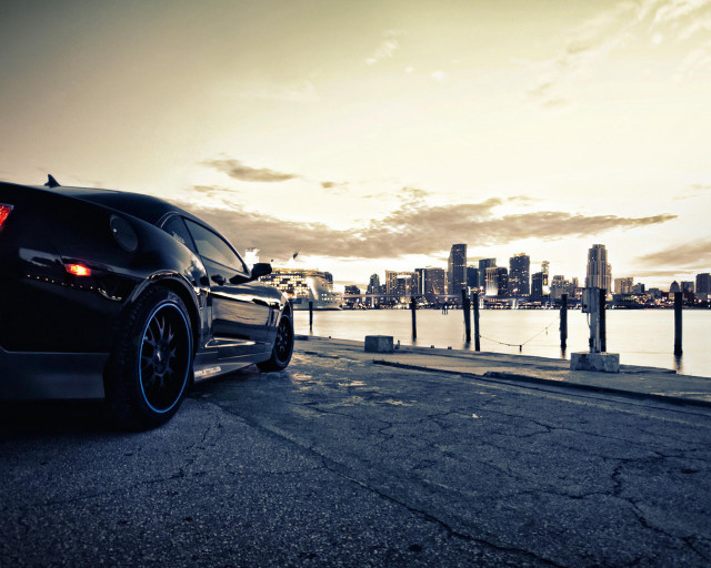 Black car road water city free wallpaper - medium preview image