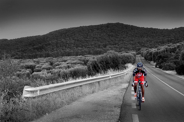 Man riding bike road green #2 free wallpaper - medium preview image